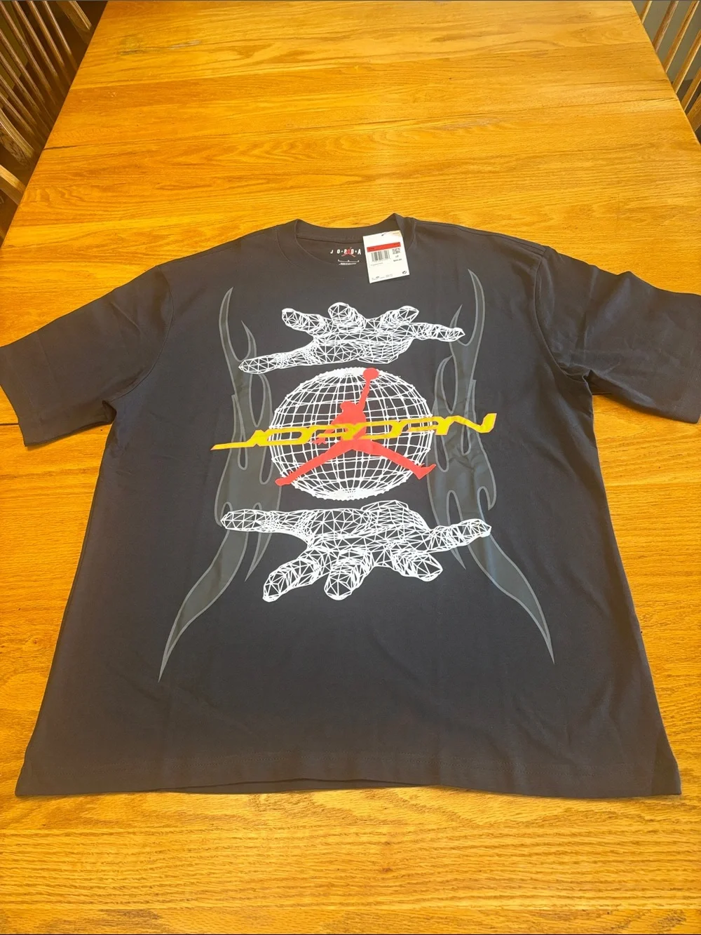 Jordan Black Short-Sleeve Graphic Tee with Red and Yellow Logo